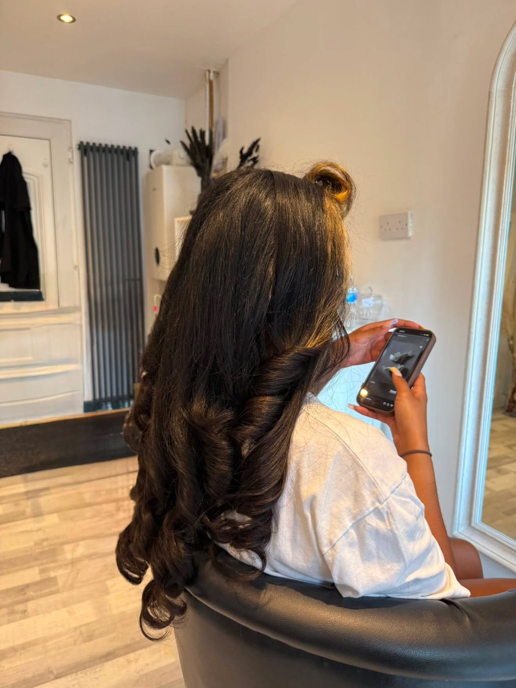 Long dark hair with a sleek blow dry and soft curled ends